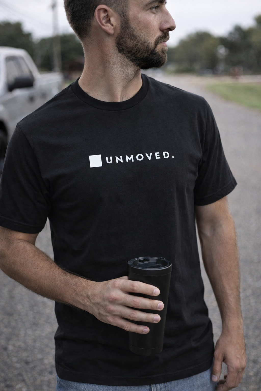 UNMOVED. Tee